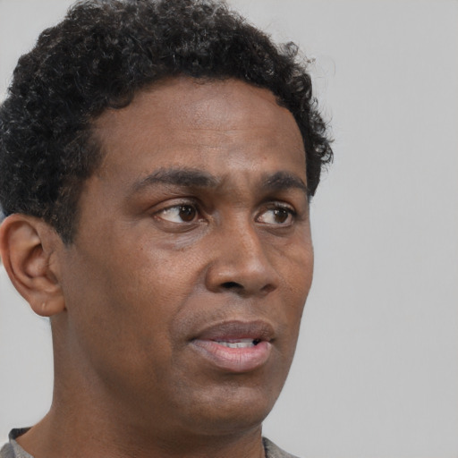 Neutral black young-adult male with short  brown hair and brown eyes