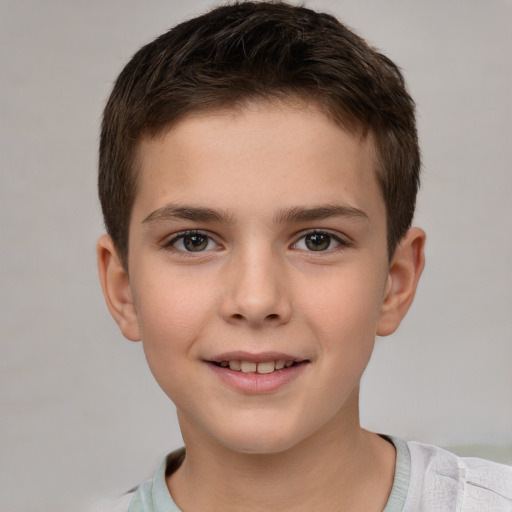 Joyful white child male with short  brown hair and brown eyes