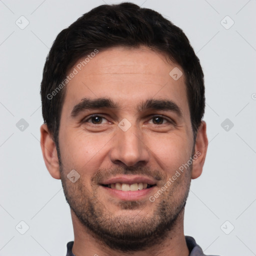 Joyful white young-adult male with short  black hair and brown eyes