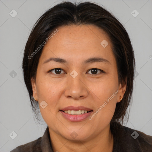 Joyful white adult female with medium  brown hair and brown eyes