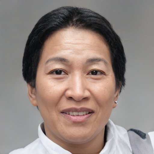 Joyful asian adult female with short  black hair and brown eyes