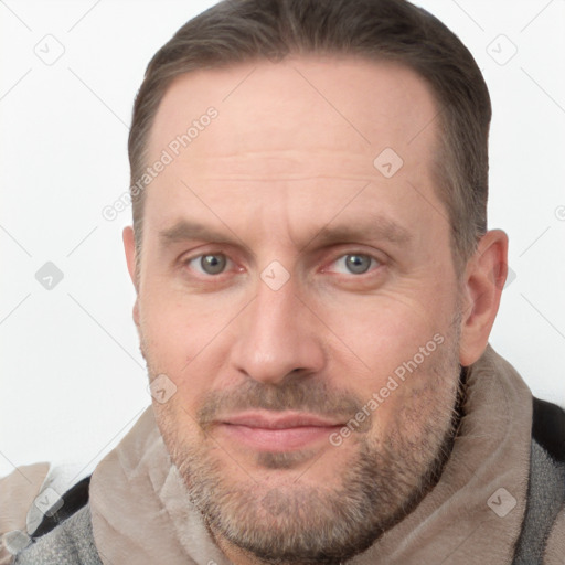 Joyful white adult male with short  brown hair and grey eyes