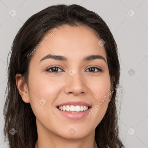 Joyful white young-adult female with long  brown hair and brown eyes