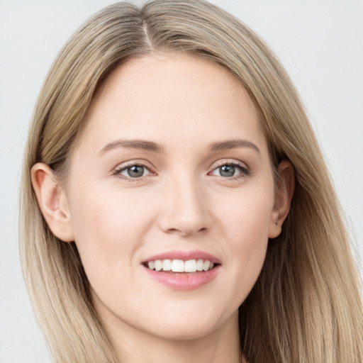 Joyful white young-adult female with long  brown hair and grey eyes