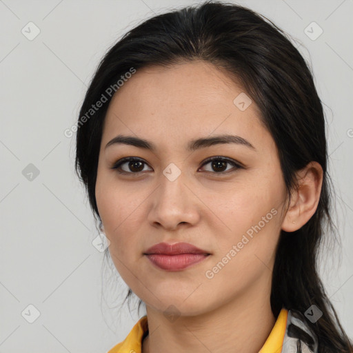 Joyful latino young-adult female with medium  brown hair and brown eyes