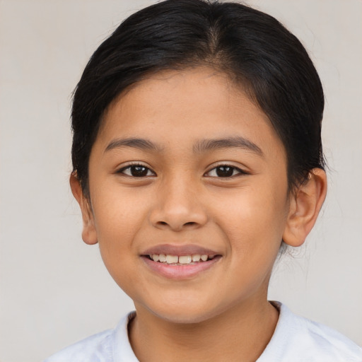 Joyful asian child female with short  brown hair and brown eyes