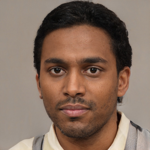 Neutral latino young-adult male with short  black hair and brown eyes