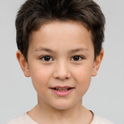 Joyful white child male with short  brown hair and brown eyes