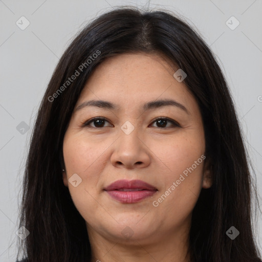 Joyful latino young-adult female with long  brown hair and brown eyes