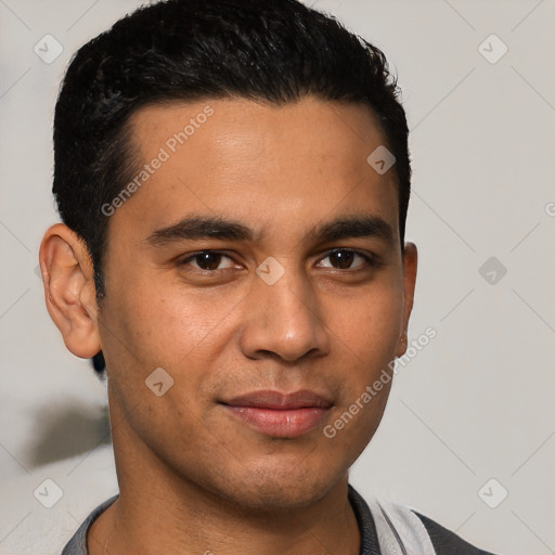 Joyful latino young-adult male with short  black hair and brown eyes