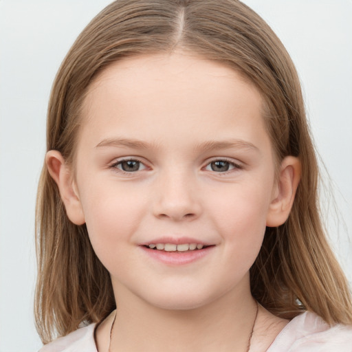 Joyful white child female with medium  brown hair and grey eyes