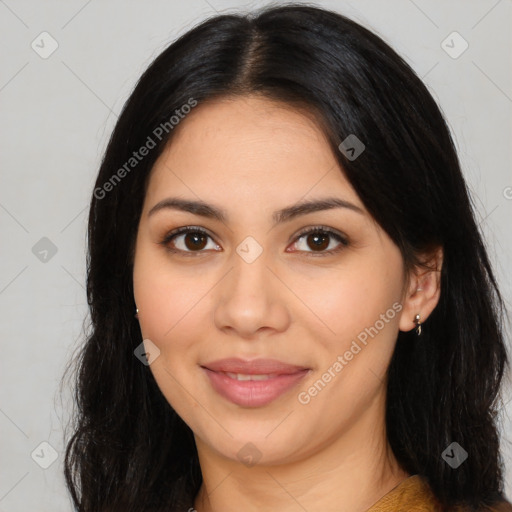 Joyful latino young-adult female with long  black hair and brown eyes