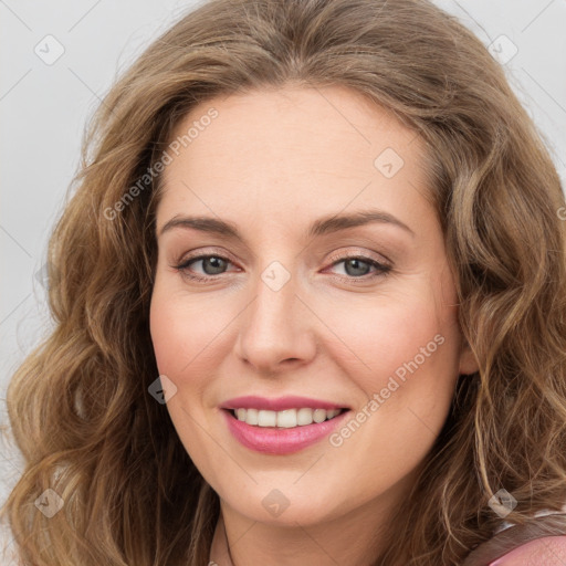 Joyful white young-adult female with long  brown hair and green eyes