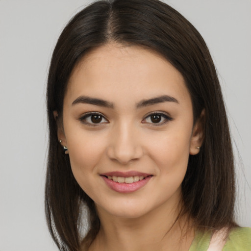 Joyful white young-adult female with medium  brown hair and brown eyes