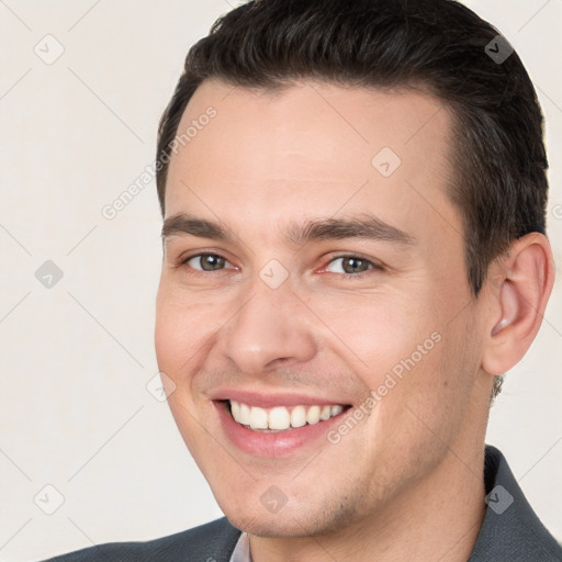 Joyful white young-adult male with short  brown hair and brown eyes