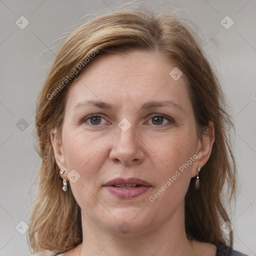 Joyful white adult female with medium  brown hair and grey eyes