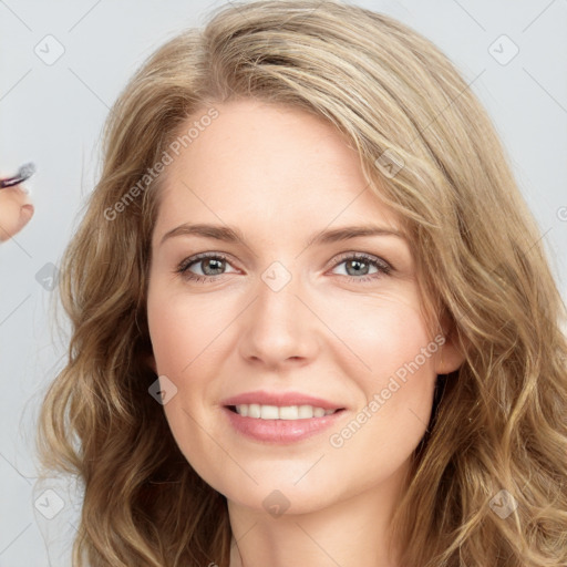 Joyful white young-adult female with long  brown hair and grey eyes