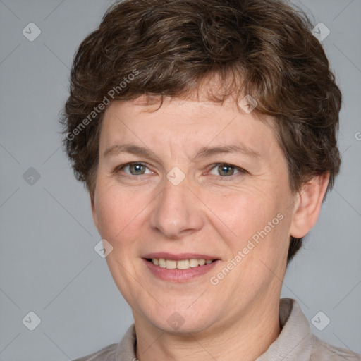 Joyful white adult female with short  brown hair and grey eyes