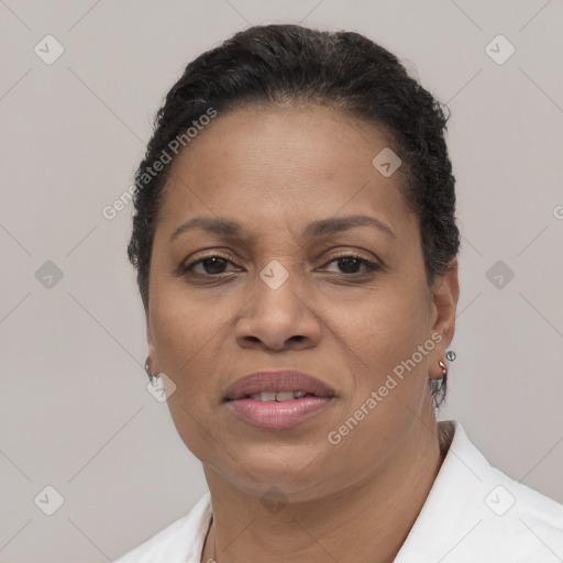 Joyful black adult female with short  brown hair and brown eyes