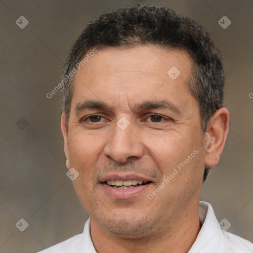 Joyful white adult male with short  brown hair and brown eyes