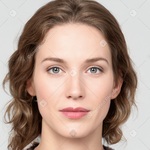 Joyful white young-adult female with medium  brown hair and green eyes