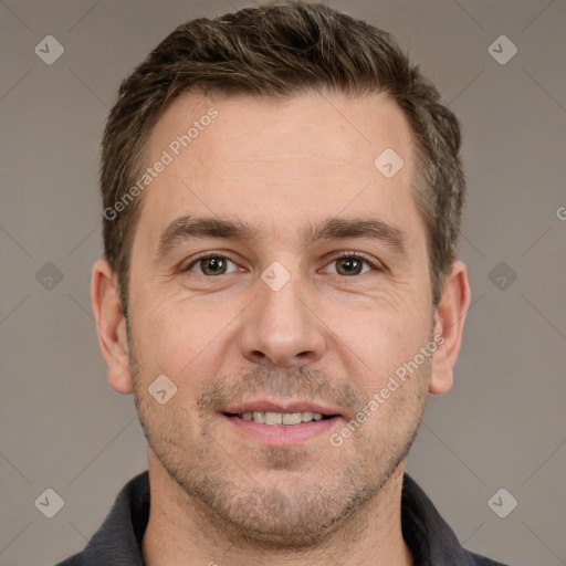 Joyful white adult male with short  brown hair and grey eyes