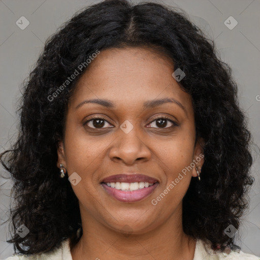 Joyful black young-adult female with medium  brown hair and brown eyes