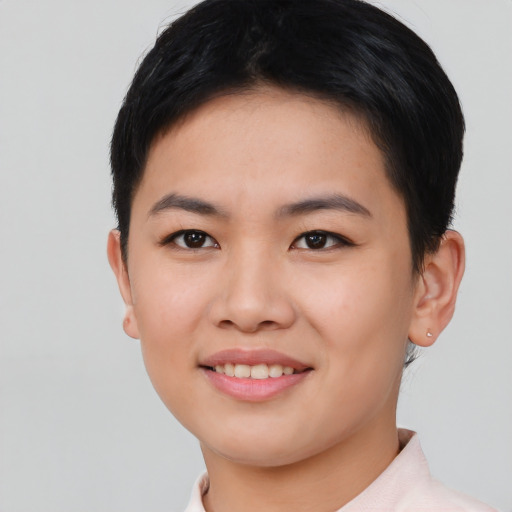 Joyful asian young-adult female with short  black hair and brown eyes