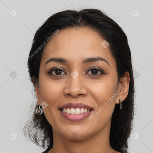 Joyful latino young-adult female with long  brown hair and brown eyes