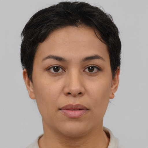 Joyful asian young-adult female with short  brown hair and brown eyes