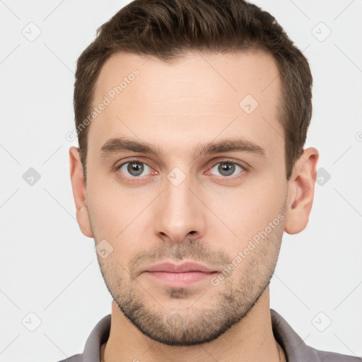 Neutral white young-adult male with short  brown hair and grey eyes