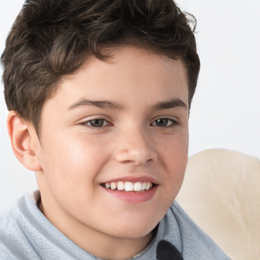 Joyful white child male with short  brown hair and brown eyes