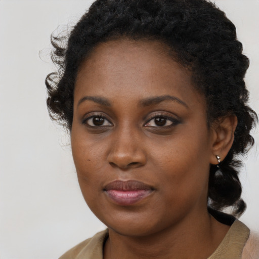 Neutral black young-adult female with medium  brown hair and brown eyes
