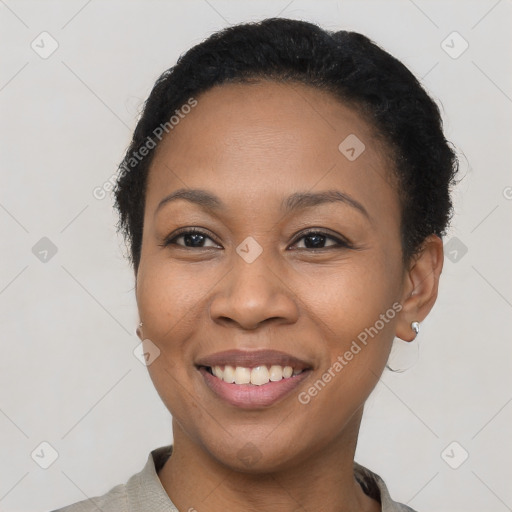 Joyful latino young-adult female with short  black hair and brown eyes