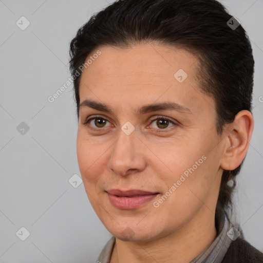 Joyful white adult female with medium  brown hair and brown eyes