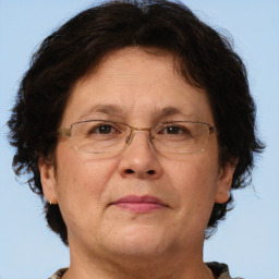 Joyful white middle-aged female with short  brown hair and brown eyes