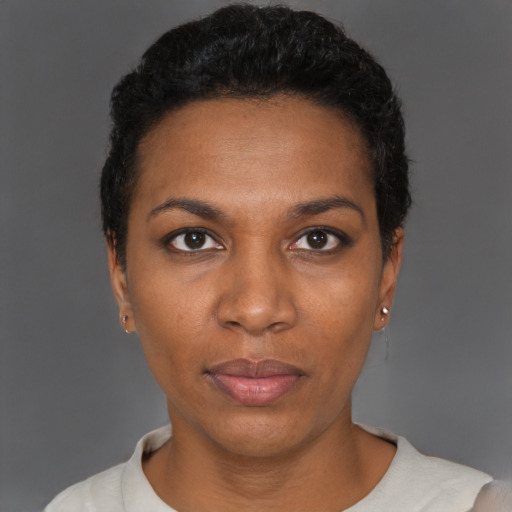 Neutral black young-adult female with short  black hair and brown eyes
