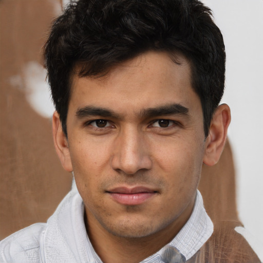 Joyful asian young-adult male with short  brown hair and brown eyes