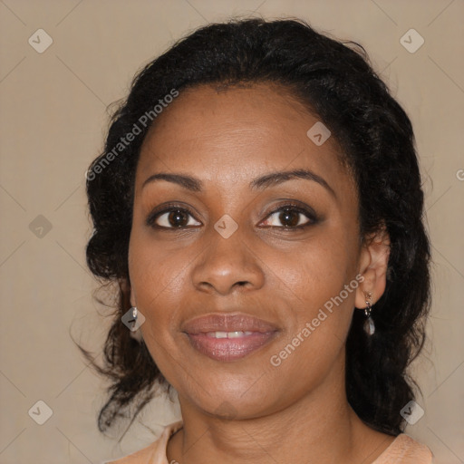 Joyful black adult female with medium  brown hair and brown eyes