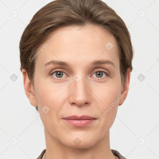 Joyful white young-adult female with short  brown hair and grey eyes