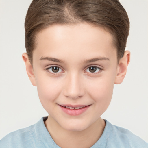 Joyful white child female with short  brown hair and brown eyes