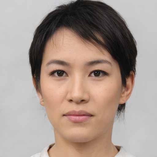 Neutral asian young-adult female with medium  brown hair and brown eyes