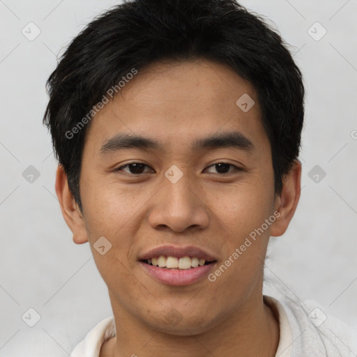 Joyful asian young-adult male with short  brown hair and brown eyes