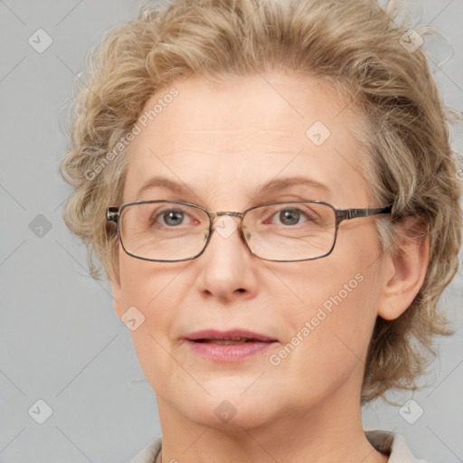 Joyful white adult female with medium  brown hair and blue eyes