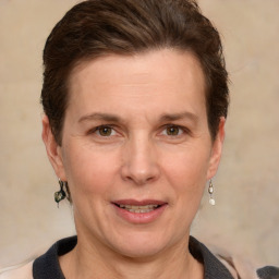 Joyful white adult female with short  brown hair and grey eyes