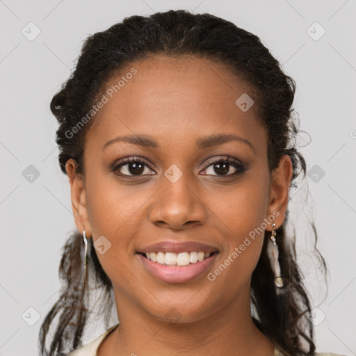 Joyful black young-adult female with long  brown hair and brown eyes