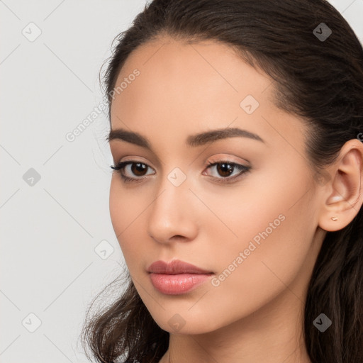 Neutral white young-adult female with long  brown hair and brown eyes