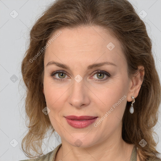 Joyful white adult female with medium  brown hair and grey eyes