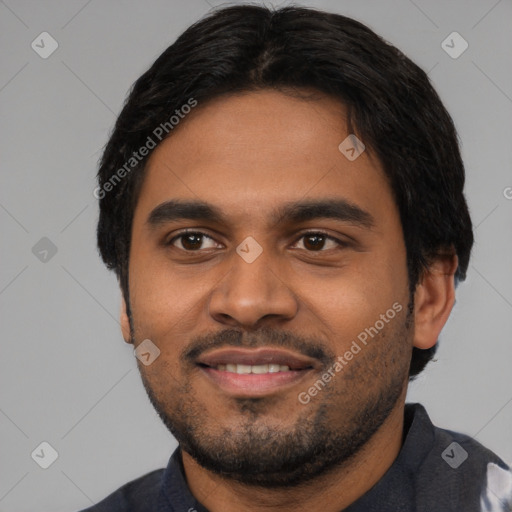 Joyful black young-adult male with short  black hair and brown eyes