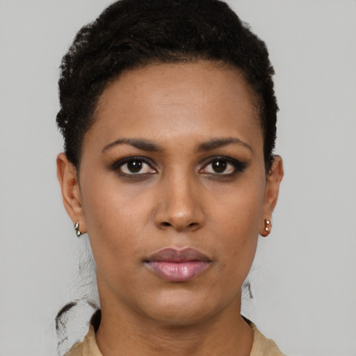 Joyful latino young-adult female with short  brown hair and brown eyes